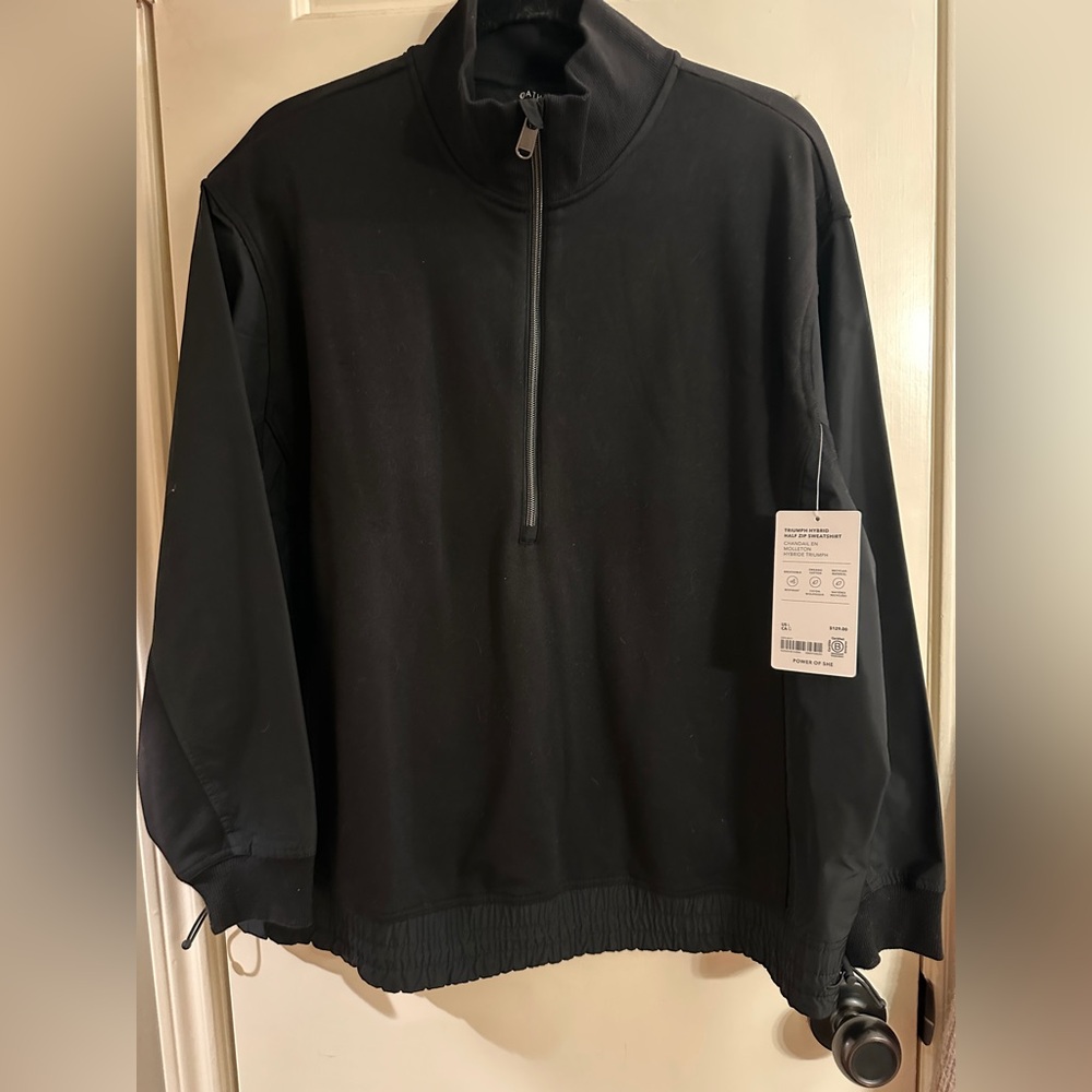 Athleta - TRIUMPH HYBRID
HALF ZIP SWEATSHIRT